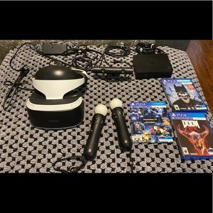 PlayStation VR with headset all cords,and plug ins camera hand devices & 3 games